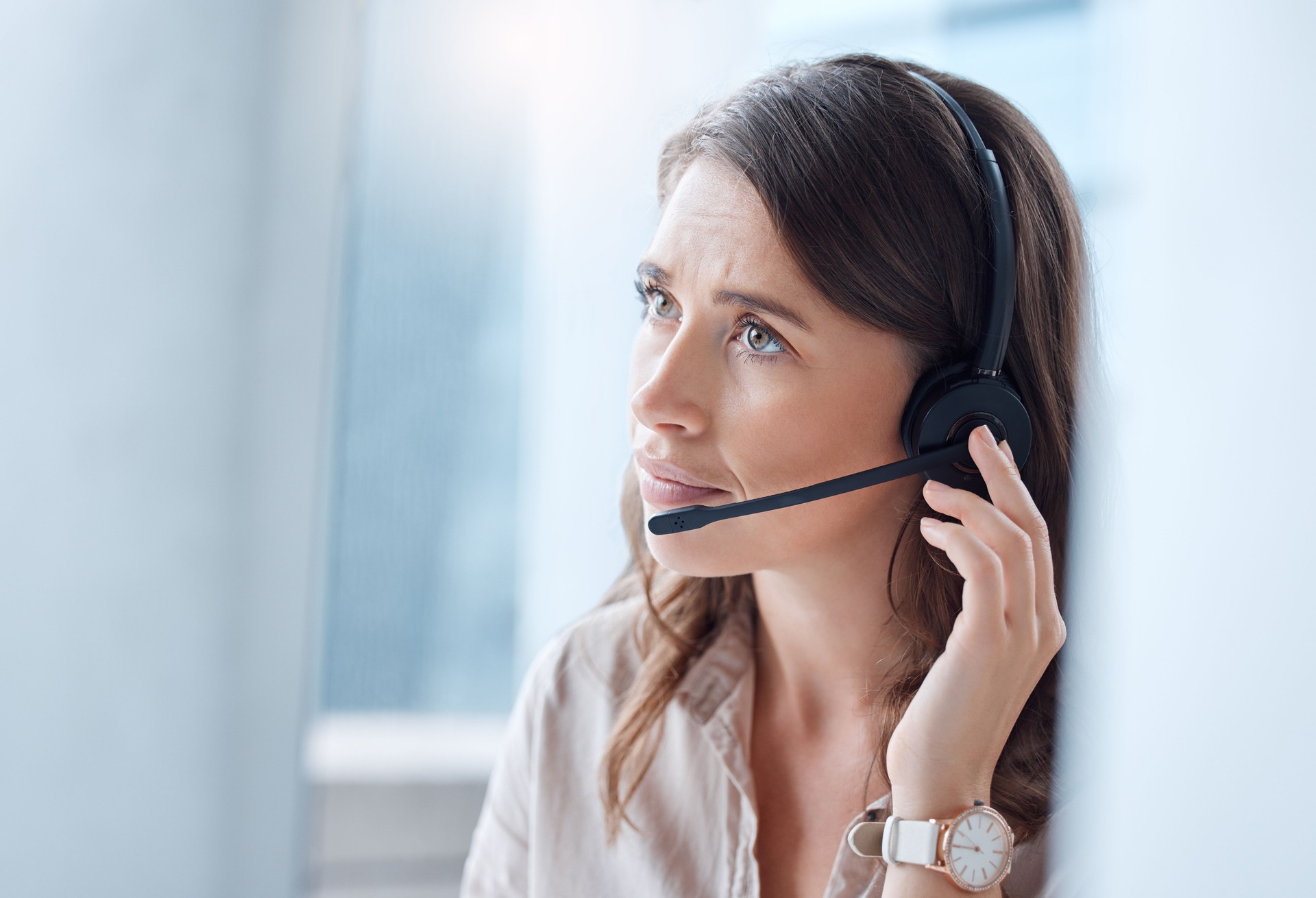 Shot of a young businesswoman working in a call center